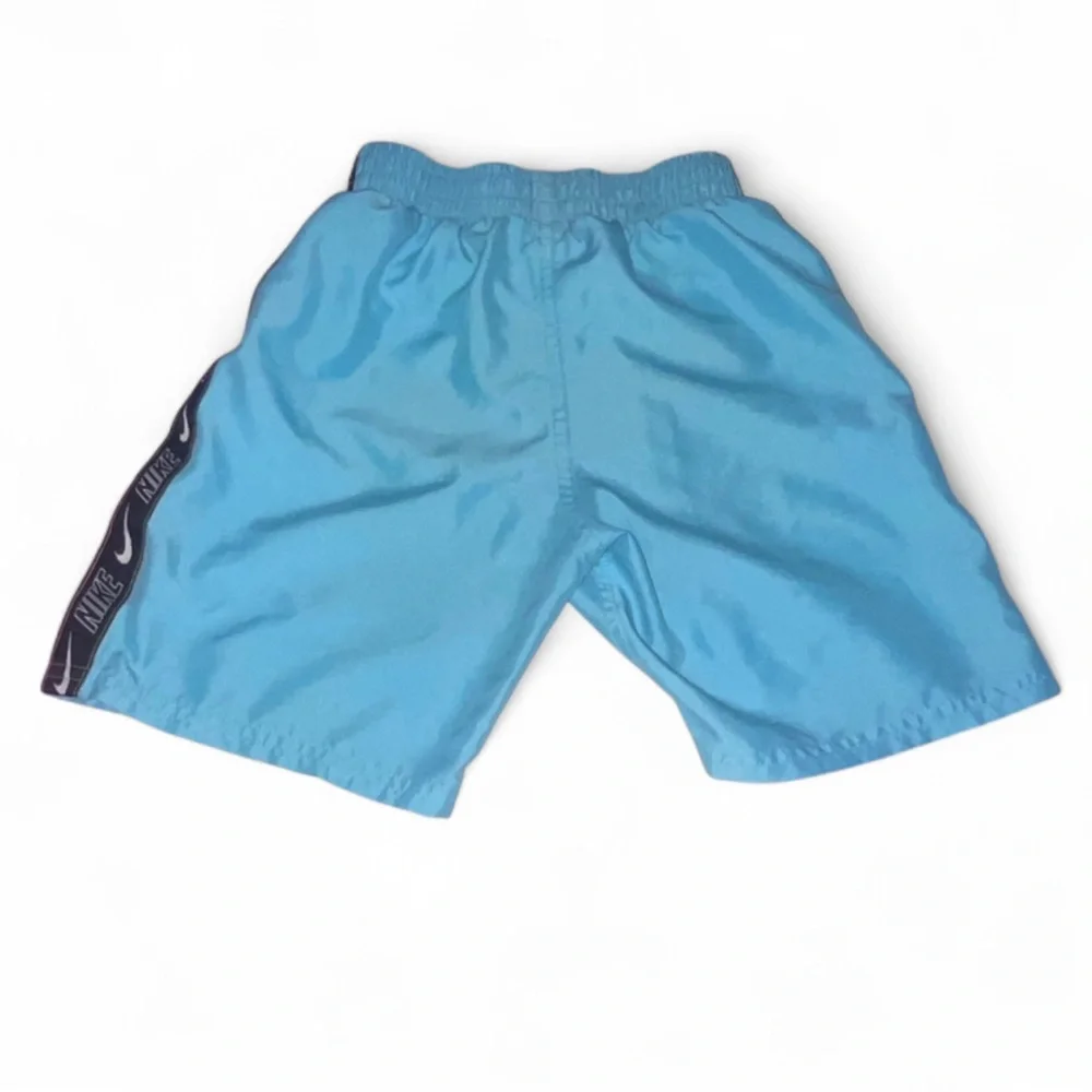 Nike boys swim trunks size 7 blue with black stripe